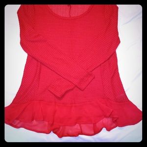 Red knit top, sheer red skirting
